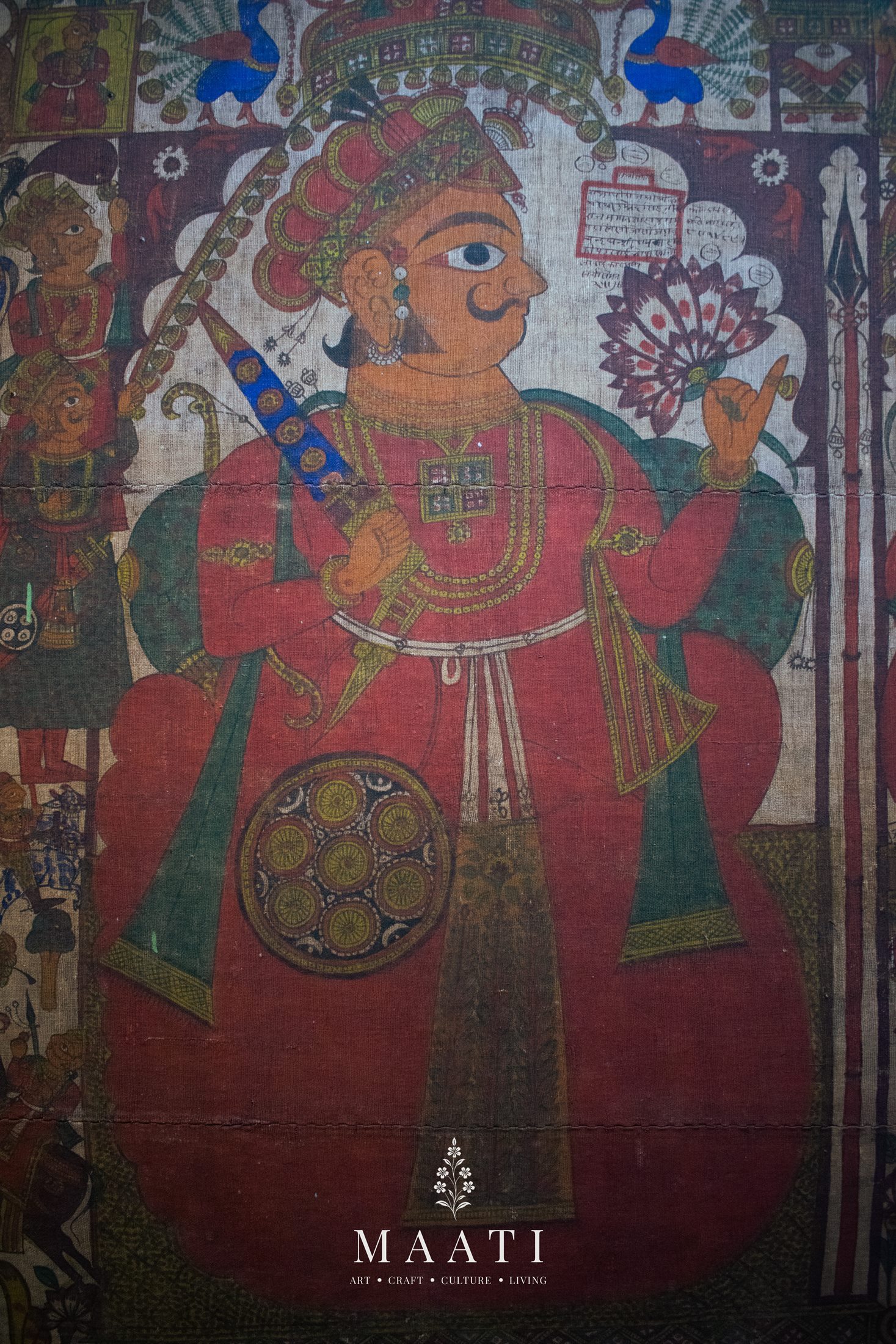 A Chitrakathi painting portrait detail of a seated figure