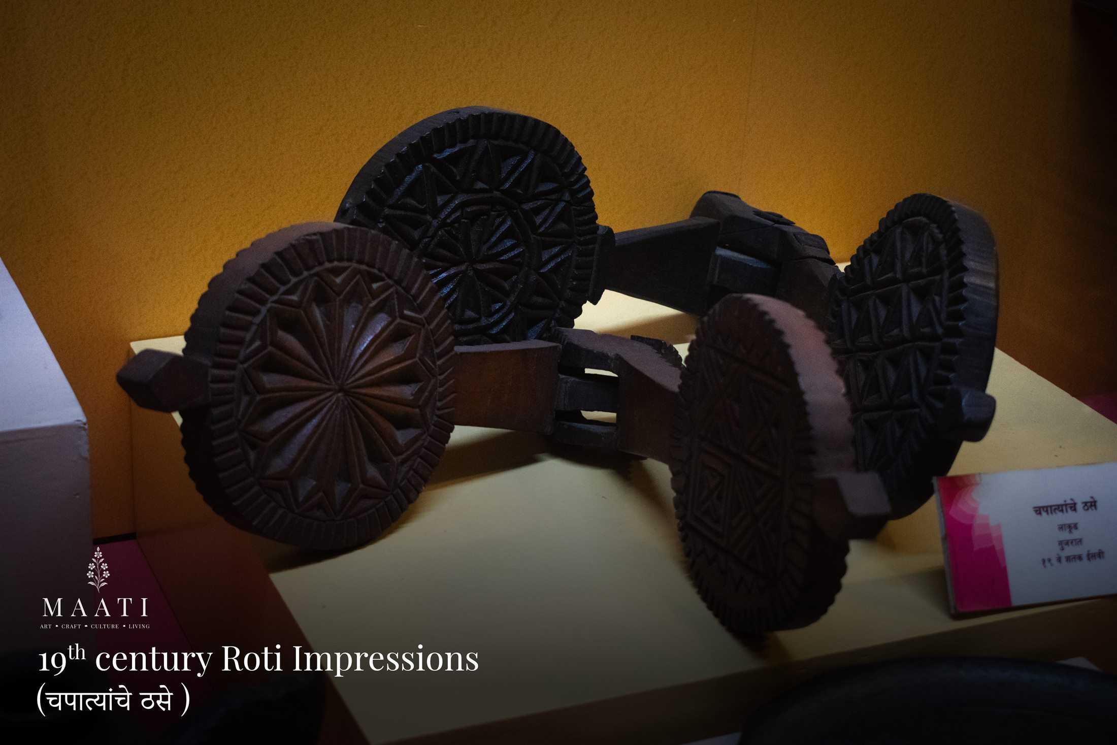 Nineteenth-century roti impression tools displayed in a museum