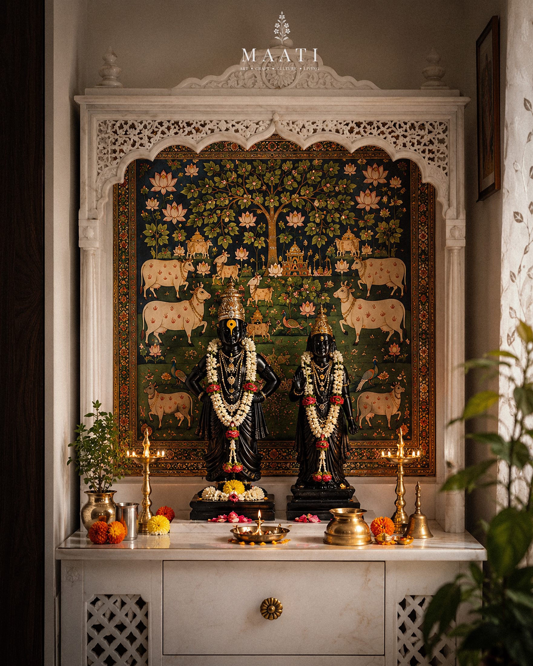 Vithal and Rukmini idols in a marble domestic shrine