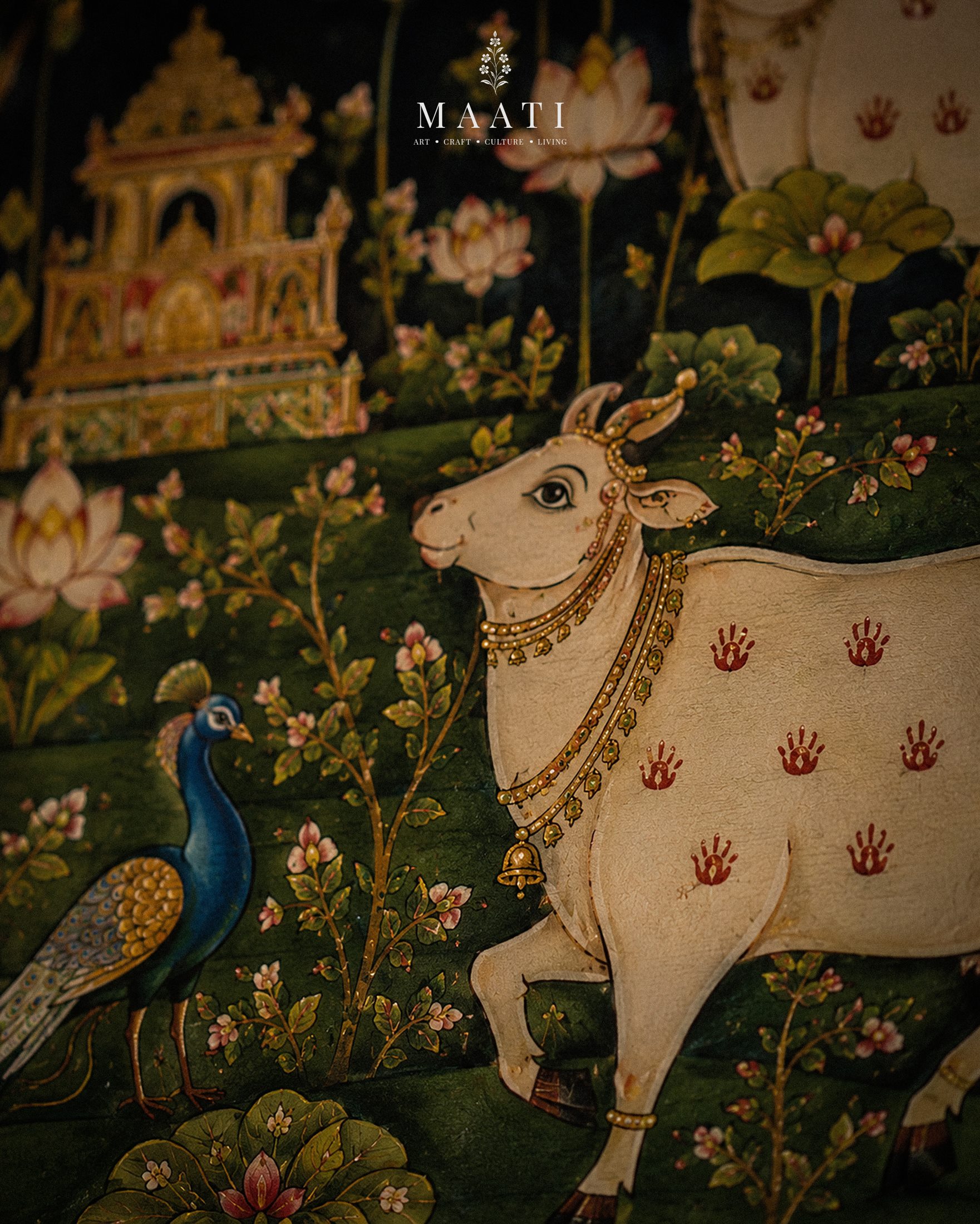 A painted cow and peacock detail behind a domestic shrine